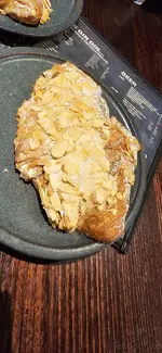 Delicious Almond Croissant full of Almond flakes. 
